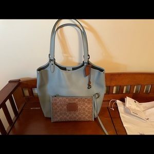 Barely used Coach polished pebble leather Everyday tote with pouch, tags.